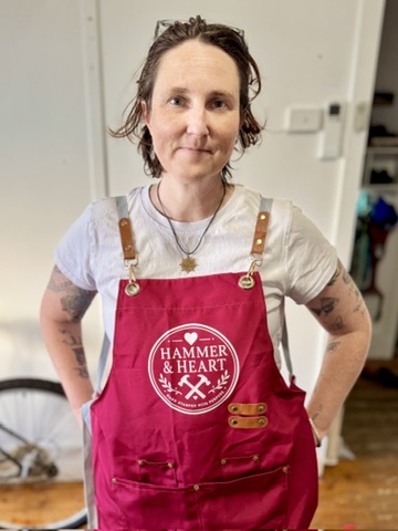 KJ in the Hammer & Heart workshop apron